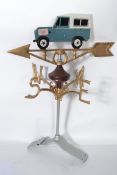 A vintage 20th century cast iron motoring related weather vane with gilt detailing and land rover