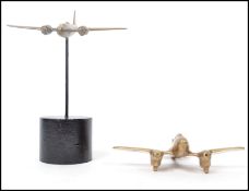 A 20th century trench art military interest brass model of a Wellington bomber raised on a large