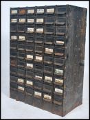 A good early 20th century 72 drawer metal Industrial filing index cabinet in the original painted