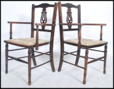 A pair of 19th century mahogany bedroom carver chairs, Hepplewhite style design, with pierced