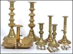 Three pair of vintage early 20th century brass candlesticks, a brass chamber stick and a group of