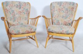 A good pair of 20th century retro Ercol Windsor armchairs. The turned legs united by stretchers