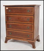 A 20th century Regency revival straight four bachelors chest of drawers. Each drawer fitted with