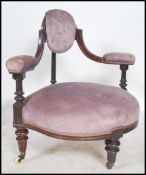 A good William IV mahogany loving armchair of triangular form being raised on reeded tapering legs