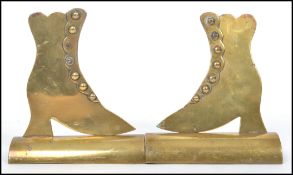 A pair of 20th century brass novelty firesides in the form of Victorian boots. Measurements:  15