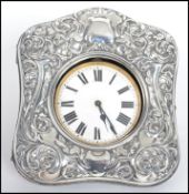 An Edwardian silver hallmarked mounted easel watch case, pierced with scrolling foliage, morocco