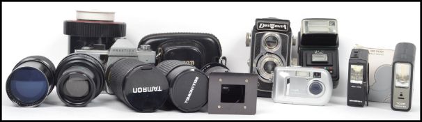 A collection of camera equipment to include a medium format Delmonta, Cimko lens 373721, Bell and