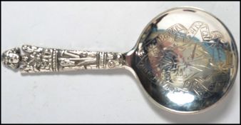 A 19th century Copenhagen silver spoon of ecclesiastical form the handle depicting religious