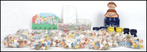 A very large collection of vintage Tetley Tea Folk figurines and tea pots consisting of many