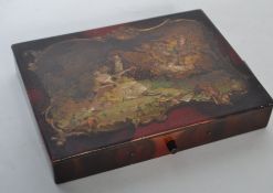 An early 20th century Continental lacquer painted box painted with lovers and putti to the hinged