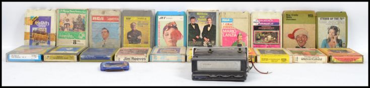 A vintage 8 track cassette player complete with many cassettes to include Paul Robeson, Bing Crosby,
