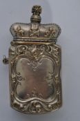 A 19th century silver plated novelty vesta with crown to top with scrolled design to the body with