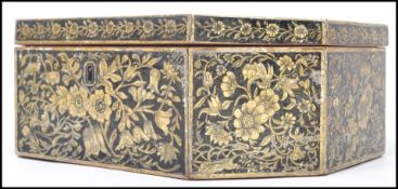 A 19th century pen painted octagonal work box, heavily decorated with floral panels, believed to