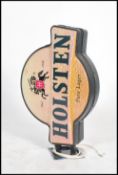 A 20th century Holsten beer advertising light box sign with good shape and coloured plastic facia'