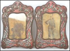 A pair of 19th century Art Nouveau easel back picture frames having a red ground with flowering