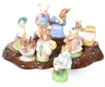 A collection of 20th century Royal Albert ceramic figures to include Hunca Munca, Pigling Bland, Mrs