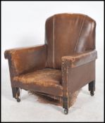 An Art Deco 20th century childs rexine covered armchair with fan shaped back having squared arms