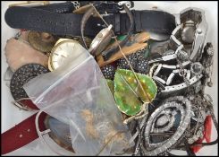 A collection of vintage costume jewellery and curious to include watches, enamel badge, brooches,