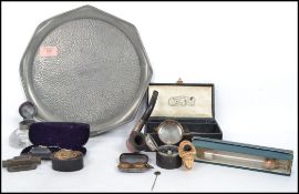 A collection of vintage curios dating back to the 19th century to include travelling ink wells,