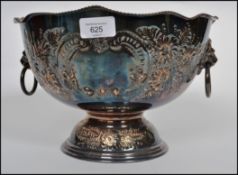 A stunning late 19th century silver plated fruit / punch bowl raised on a pedestal, having twin lion