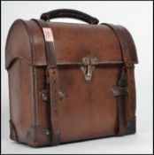 A good early 20th century leather dome top cased workman's satchel bag complete with buckles