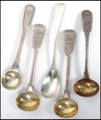 A collection of 5 silver hallmarked table condiment ladels all of varying size to include Georgian
