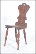 A late 19th / early 20th century  oak hall chair,