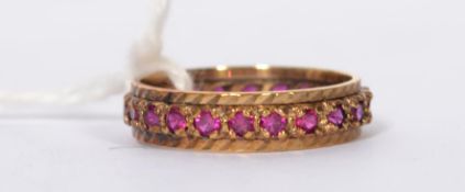 A 9ct gold hallmarked 22 ruby stone full eternity ring, all rubies are round and claw set in