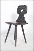 A 19th century Victorian hall chair having a pierced heart lyre back with square panel seat raised