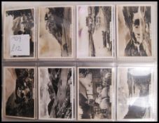 Cigarette Cards: An album of assorted vintage cigarette cards, all complete sets. From a large