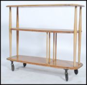An Ercol beech and elm wood 20th century low room divider having chamfered edge lozenge shaped tiers