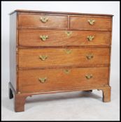 A Georgian mahogany 2 over 3 chest of drawers being ebony line inlaid with brass swing handles and