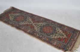 A Persian style floor rug carpet runner having a central tree of life pattern with decorative