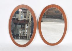 A pair of vintage mid 20th century Danish influence retro frame less circular wall mirrors mounted