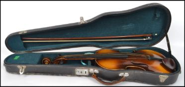 A vintage 20th century Czechoslovakian Stradivarius copy violin with label to interior complete in