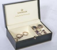 A collection of sterling silver dress rings to include garnet stone ring, amethyst ring, inset shell