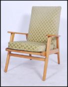 A retro mid century Danish inspired armchair having show wood angular teak frame with with swept