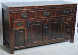 A good early 20th century Chinese / Korean sideboard dresser having ebonised finish with a series of