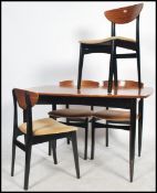 A set of four G-Plan Librenza style dining chairs and matching extendable teak wood table, butterfly