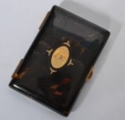 A 19th century tortoise shell aide de memoir with gold inset lozenge with monogram to centre