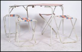 A retro 1960's folding metamorphic camping table in Orange VW colourway, the table opening to reveal
