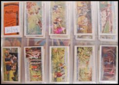 Cigarette / Trading Cards: An album of assorted vintage tea trading cards, all complete sets. From a