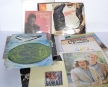A collection of vinyl long play record albums to include several Rod McKuen, Cliff Richard, Precious