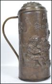 A 19th century lidded copper tankard having a shaped handle, the body depicting a Dutch master