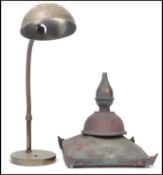 A vintage retro 20th century goose neck anglepoise lamp raised on circular base along with a vintage