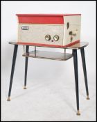 A vintage 20th century retro mid century Dansette record player having a two tone case with