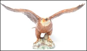 A Beswick - large early bird figure ' Bald Eagle ' Model 1018, of an eagle with it's wings at full