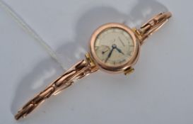 A 9ct gold vintage Longines wrist watch set to an expanding 9ct gold bracelet, Total weight 20.6