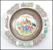 A 19th century Oriental ceramic bowl having a serpentine border with white cartouche panels