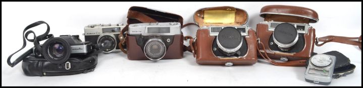 A collection of 5 vintage 20th century Japanese SLR camera's to include Mamiya, Yashika, Konica,